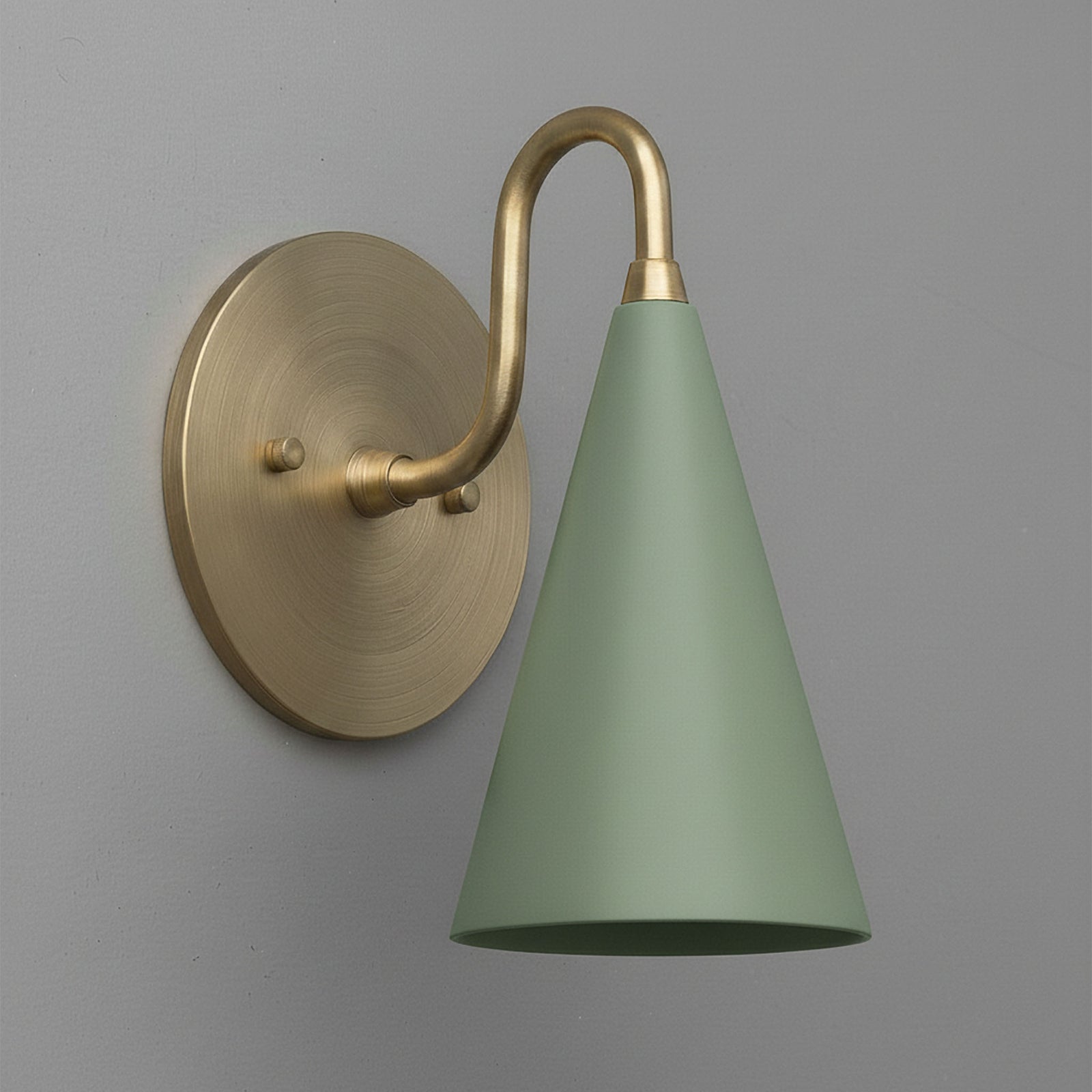 Antique brass sconce with matte sage green conical shade mounted on round backplate. - Sconce Model No. 2900