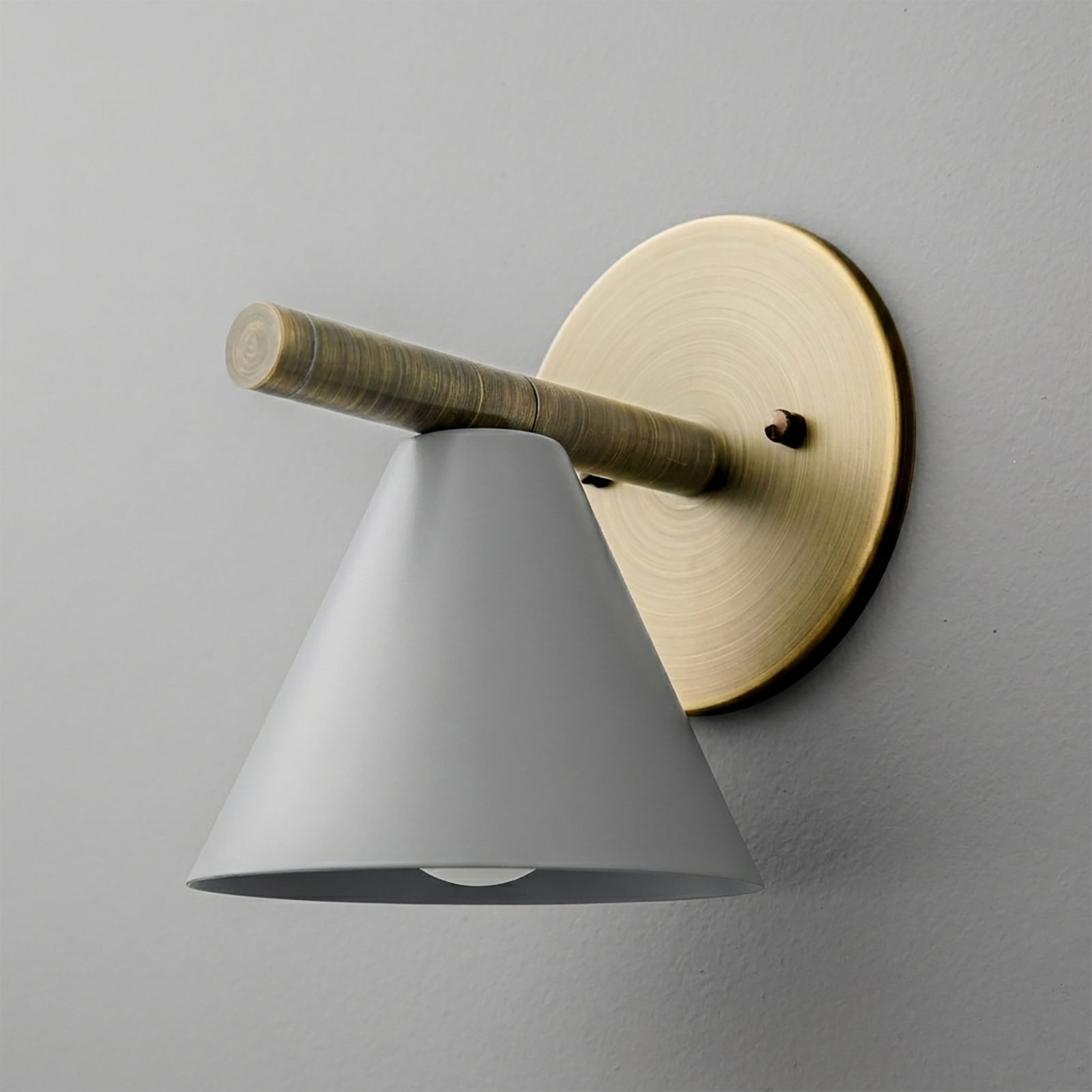 Wall sconce with matte gray conical shade, brass circular backplate, and horizontal brass arm. - SCONCE MODEL NO. 5075