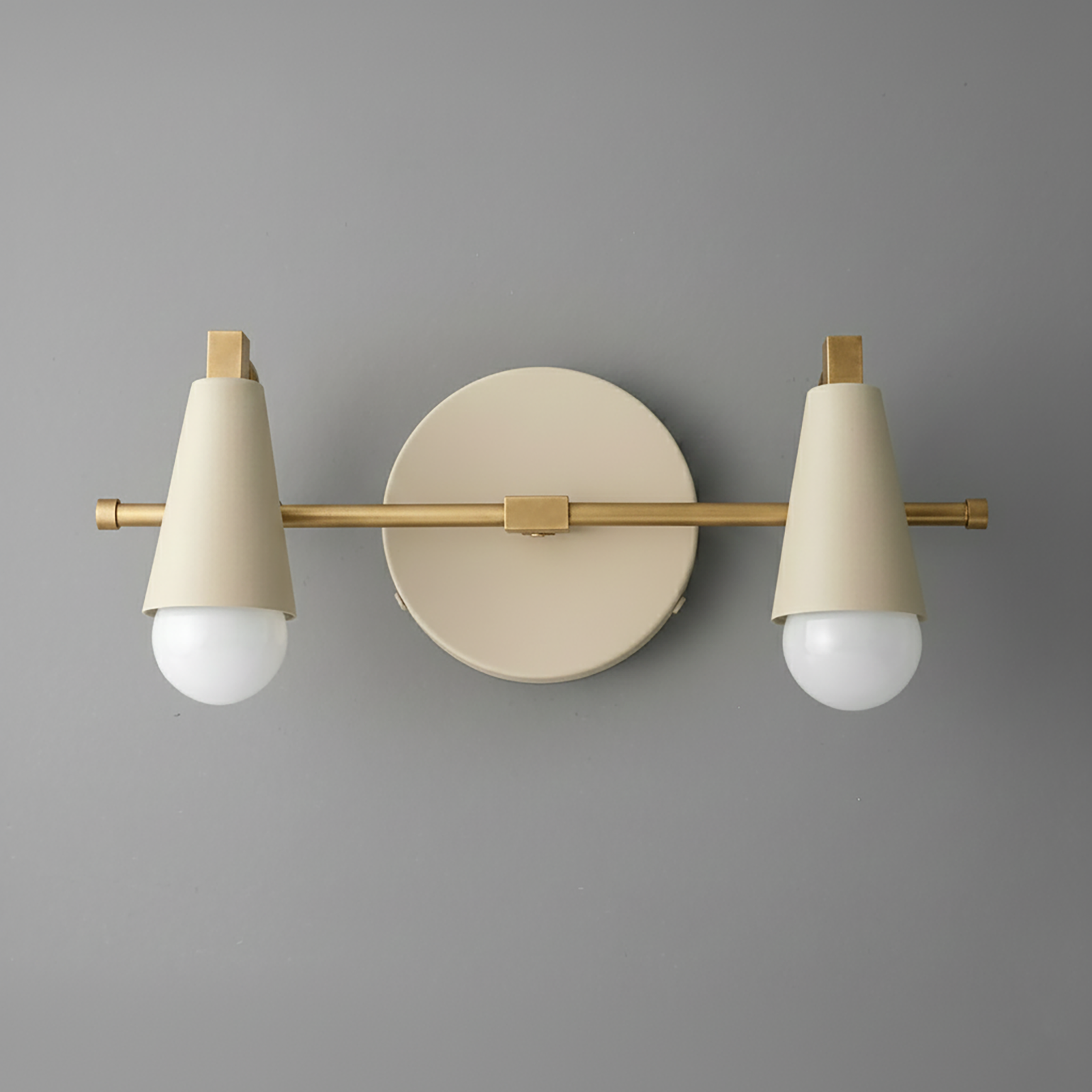 Two-bulb beige vanity light with conical metal shades and brass horizontal bar mount. - VANITY LIGHT MODEL NO. 1229
