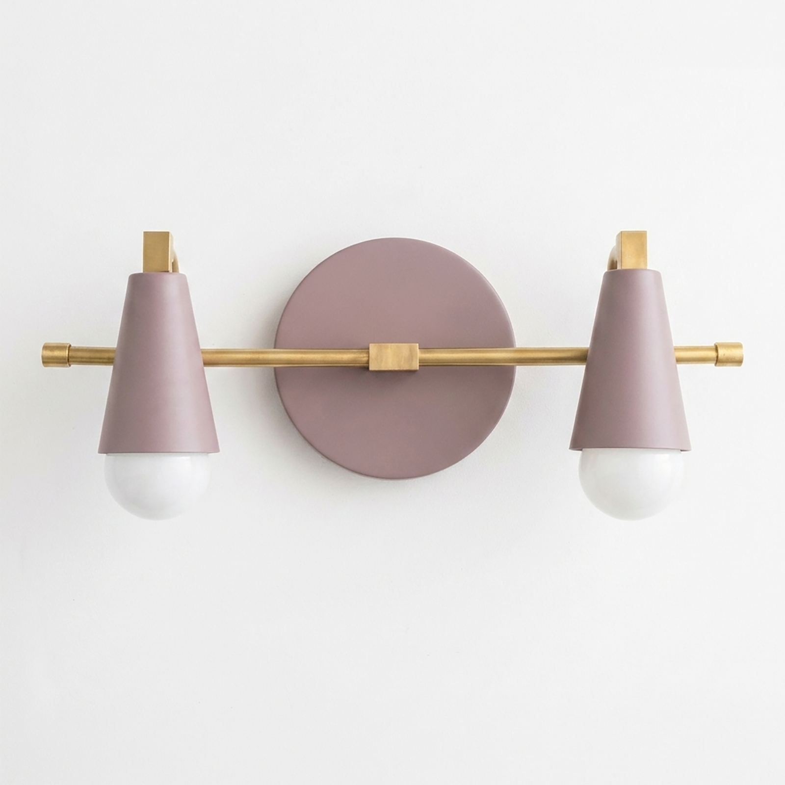 Scandinavian-style 2-bulb vanity light with matte mauve metal shades and brushed brass horizontal bar and wall mount. - VANITY LIGHT MODEL NO. 1229