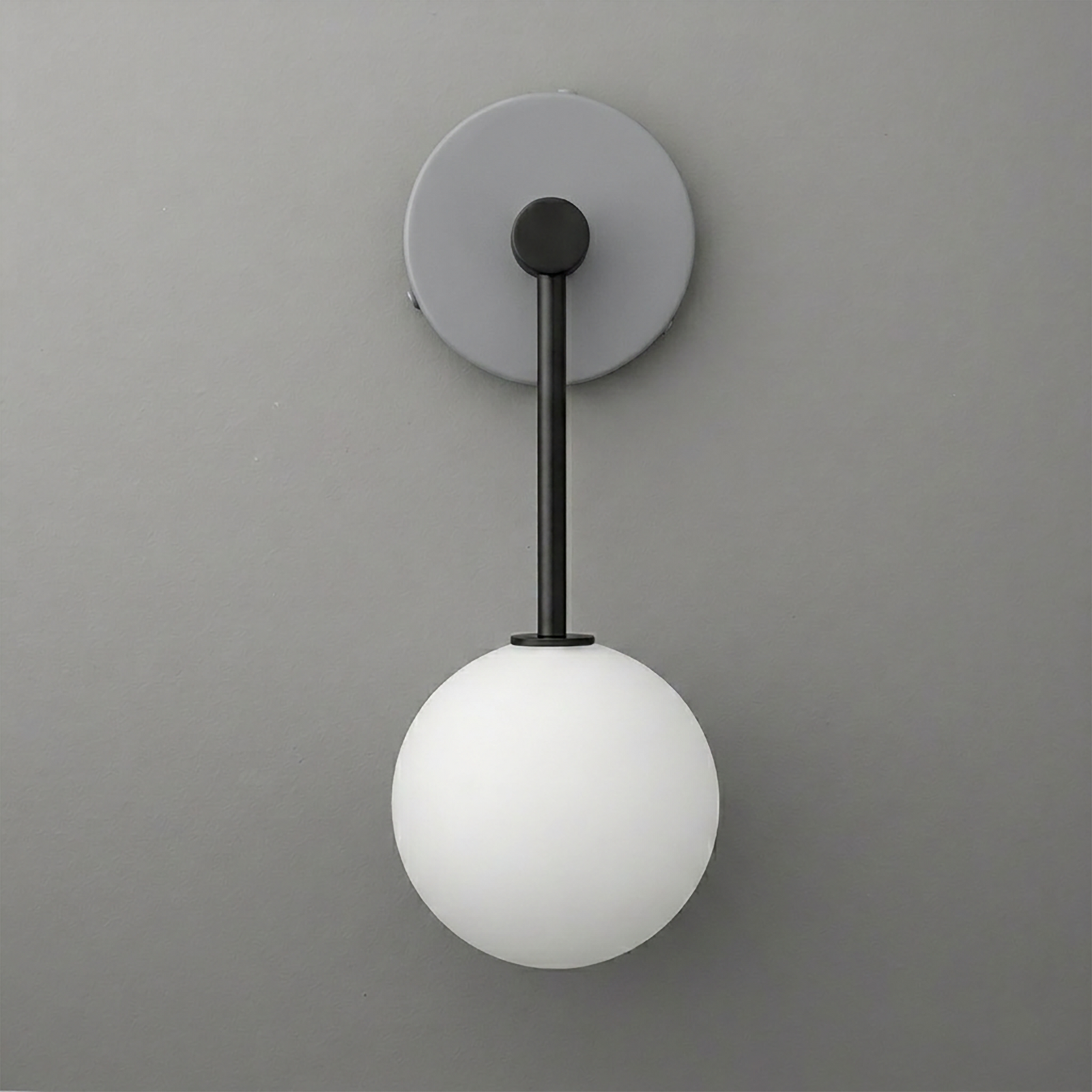 Wall sconce with matte black metal rod and round white frosted glass globe shade. - Sconce Model No. 5999