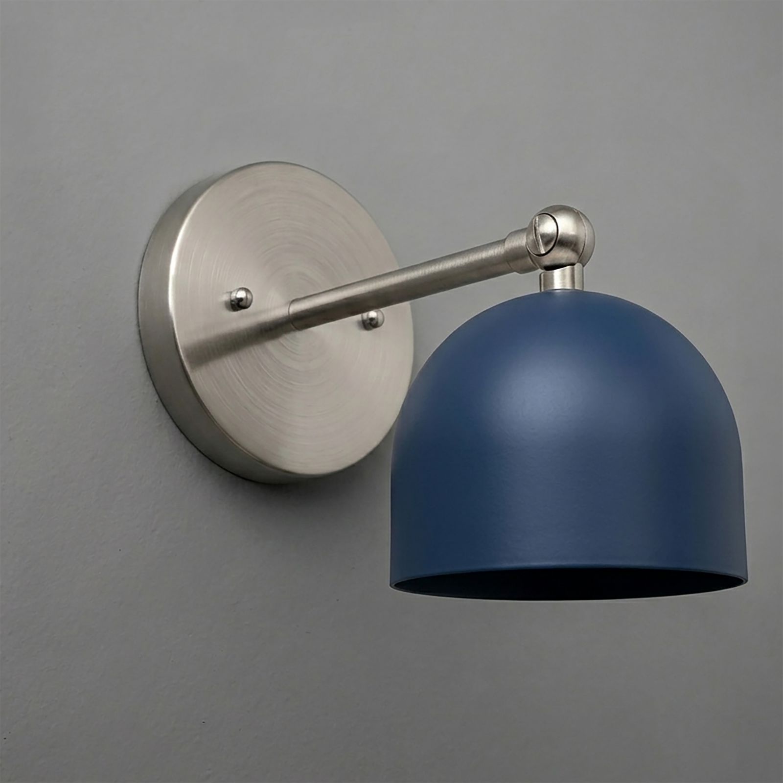 Brushed nickel wall sconce with a single matte navy blue dome shade and adjustable arm. - SCONCE MODEL NO. 5103