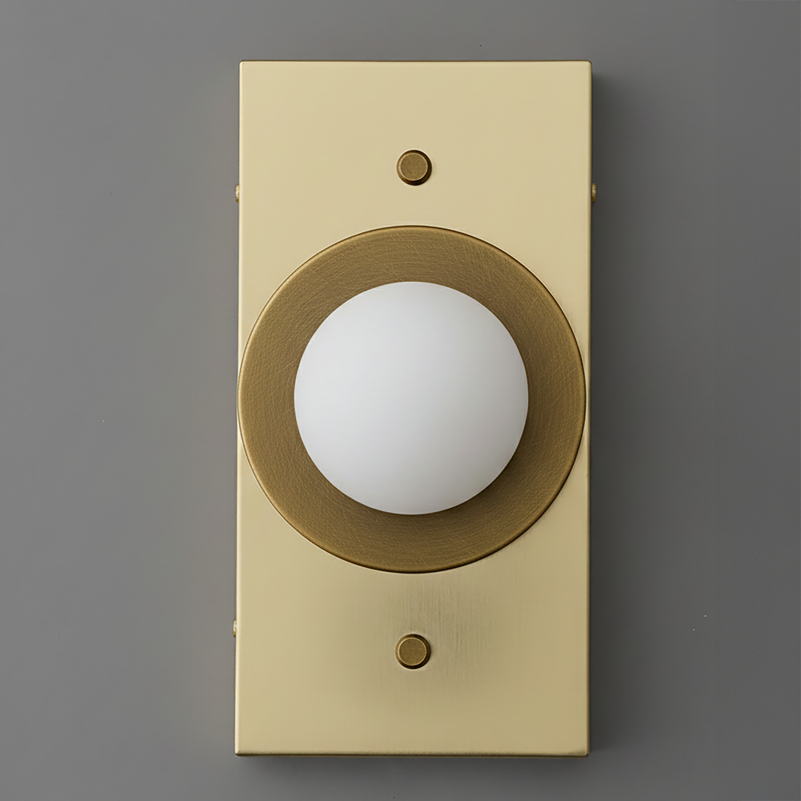 Antique brass rectangular sconce with round white globe light and circular brass accent ring. - SCONCE MODEL NO. 4474