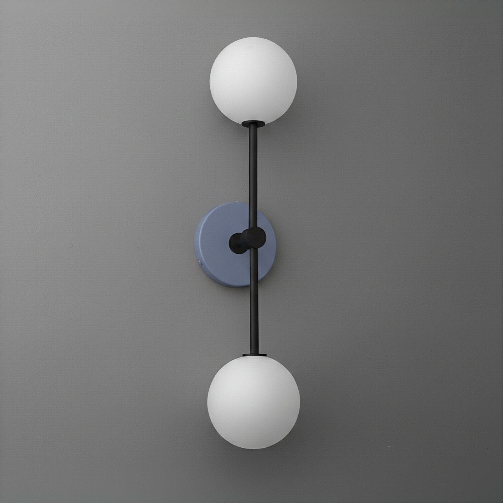 Wall sconce with matte black rod and round periwinkle blue mounting plate, featuring two white glass globe shades. - SCONCE MODEL NO. 9776