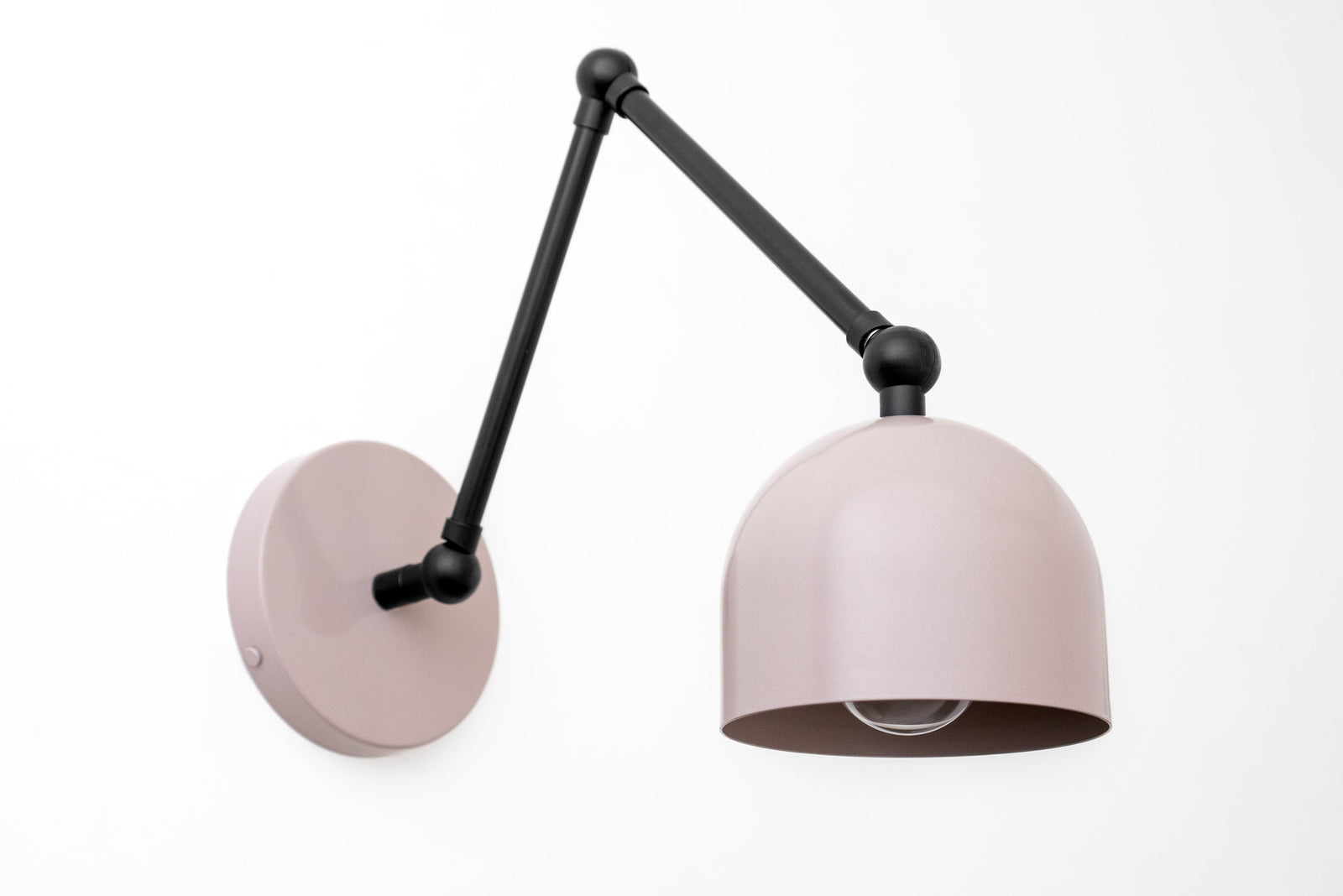 Adjustable industrial wall sconce with matte black arm and pale pink dome shade. - SCONCE MODEL NO. 5998