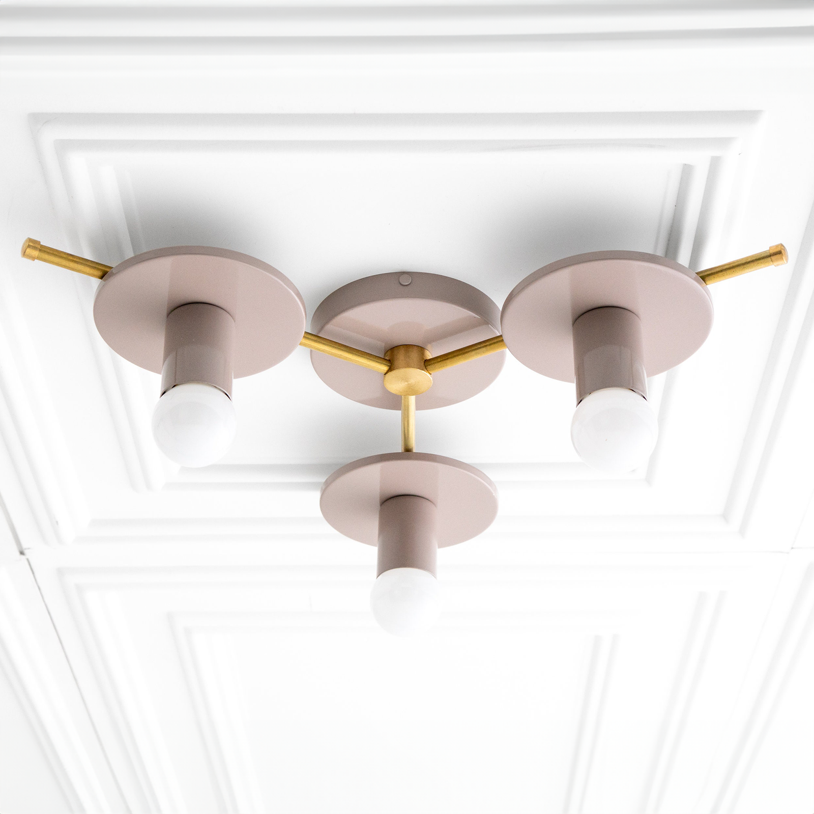 Mid-century modern flush mount chandelier with mauve circular bases and raw brass rods holding four exposed bulbs. - CHANDELIER MODEL NO. 9526