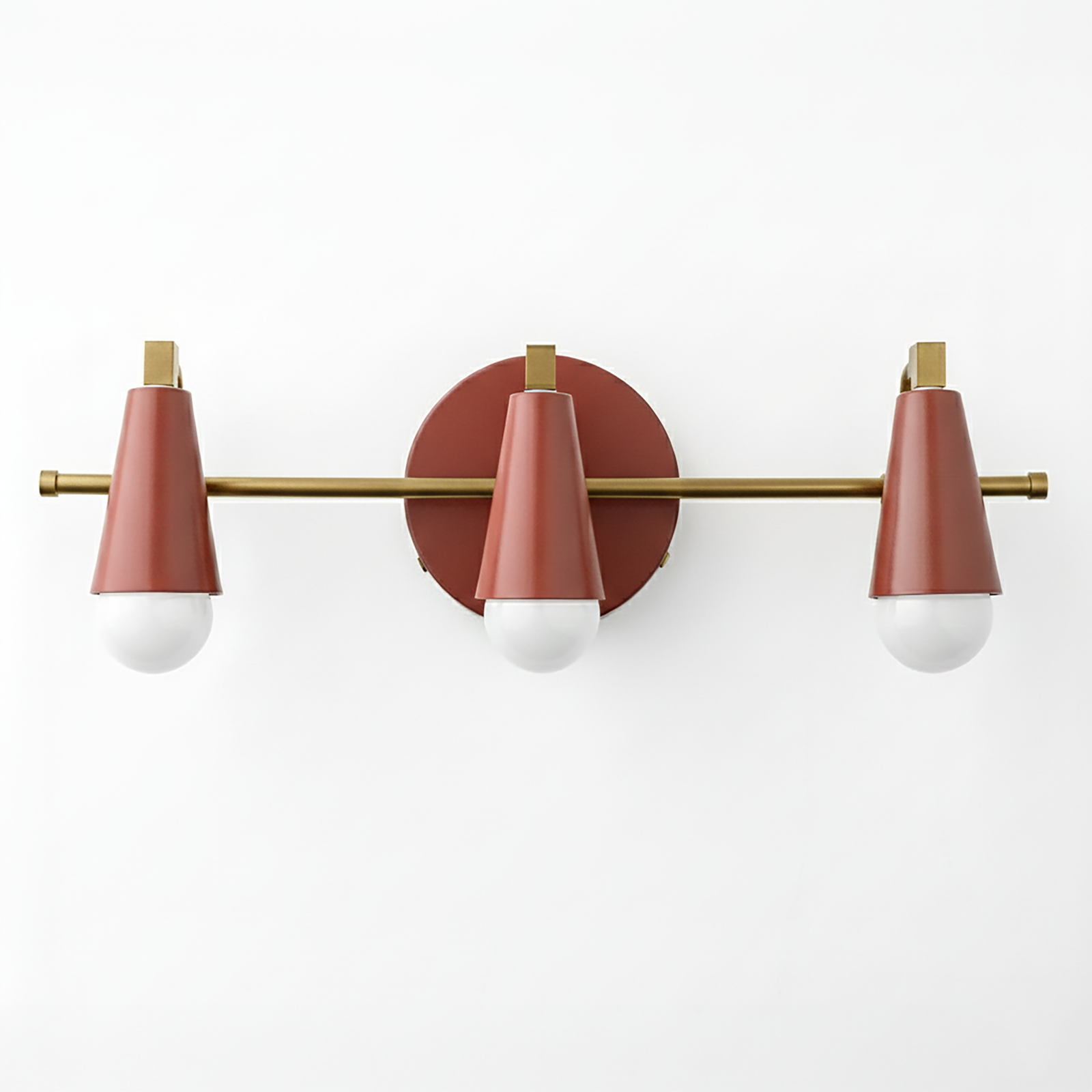Mid-century modern 3-bulb vanity light with matte rose gold cone shades and brass accents. - VANITY LIGHT MODEL NO. 8084