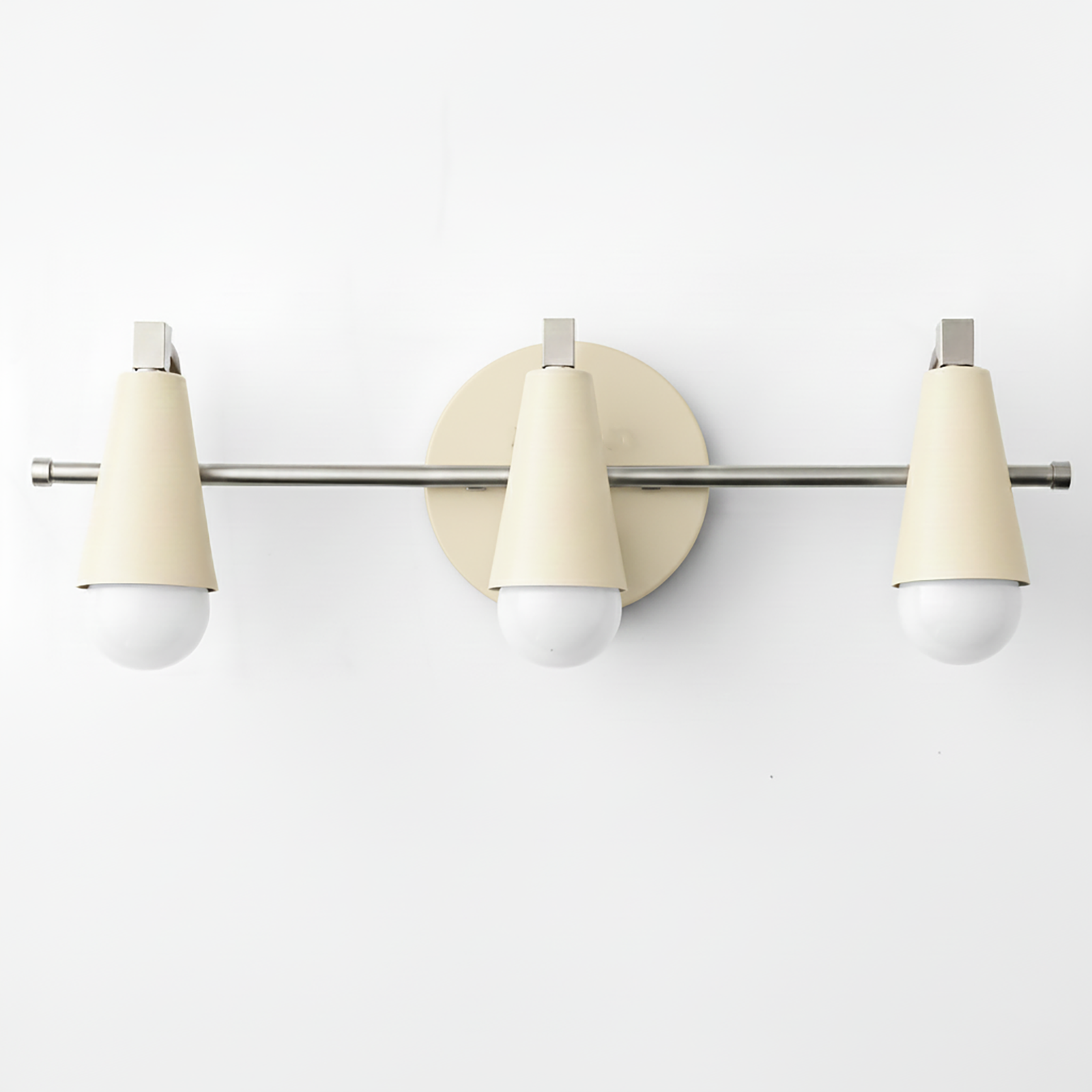 Three-light vanity fixture with matte cream cone shades and polished chrome hardware. - VANITY LIGHT MODEL NO. 8084