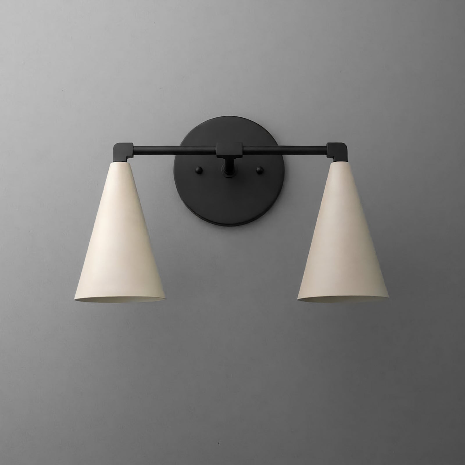 Two-light vanity light in Black with Cream cone shades on a straight arm and a round wall plate. - VANITY LIGHT MODEL NO. 1184