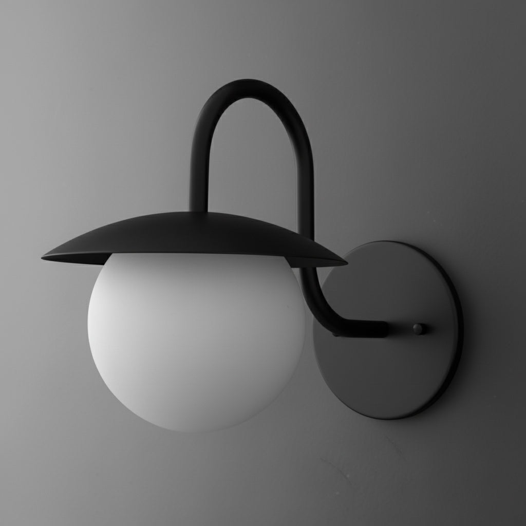 Matte black wall sconce with curved arm holding a frosted white glass globe shade beneath a broad, flat metal shade. - SCONCE MODEL NO. 2206