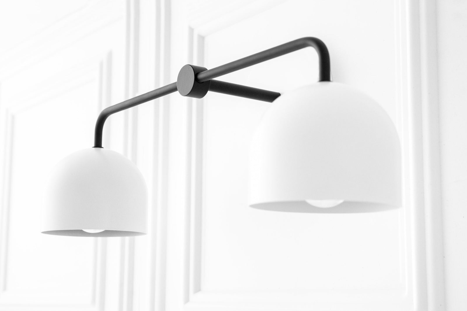 Mid-century modern vanity light with two matte white dome shades and black metal frame. - VANITY LIGHT MODEL NO. 2082