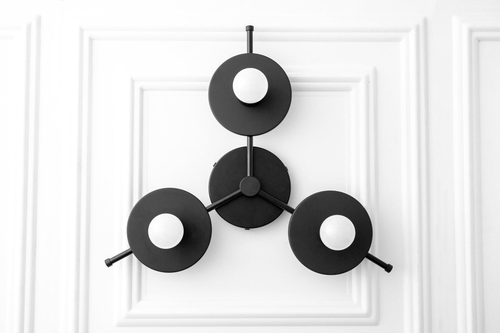 Black mid-century modern flush mount chandelier with three circular bare bulb fixtures. - CHANDELIER MODEL NO. 9526