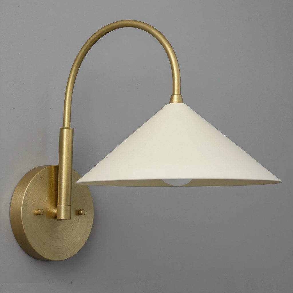Antique brass wall sconce with curved arm and cream conical fabric shade. - Sconce Model No. 1583
