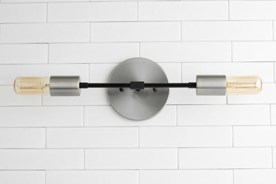 VANITY MODEL No. 5109- Industrial bathroom lighting with a Black finish. Designed and produced by newwineoldbottles at Peared Creation