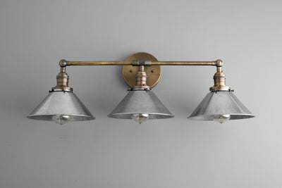 VANITY MODEL No. 5558- Industrial bathroom lighting with a Antique Brass finish. Designed and produced by newwineoldbottles at Peared Creation