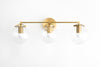 VANITY MODEL No. 4357- Mid Century Modern bathroom lighting with a Raw Brass finish. Designed and produced by MODCREATIONStudio at Peared Creation