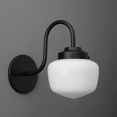 Matte black metal wall sconce with curved arm and white frosted glass globe shade. - SCONCE MODEL NO. 1012