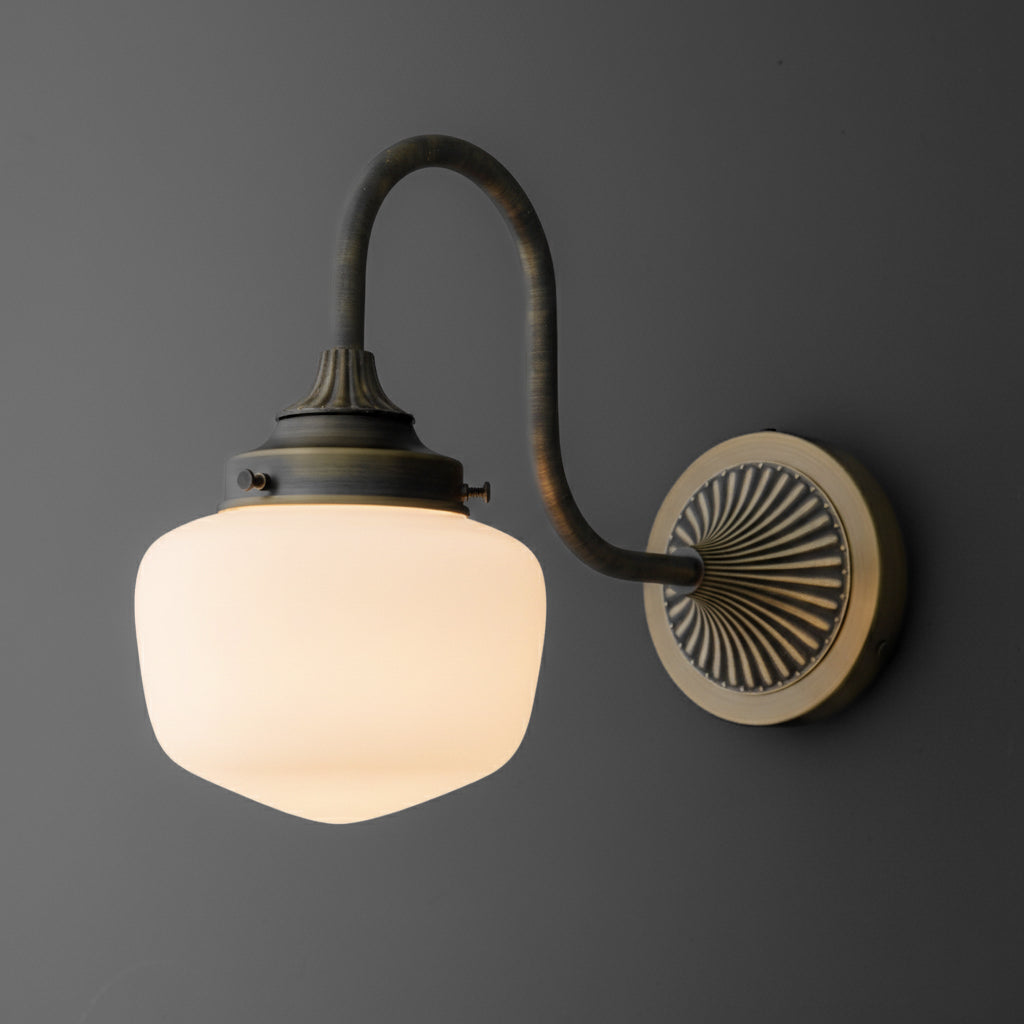 Wall-mounted sconce with curved antique bronze arm and frosted glass shade. - SCONCE MODEL NO. 1061