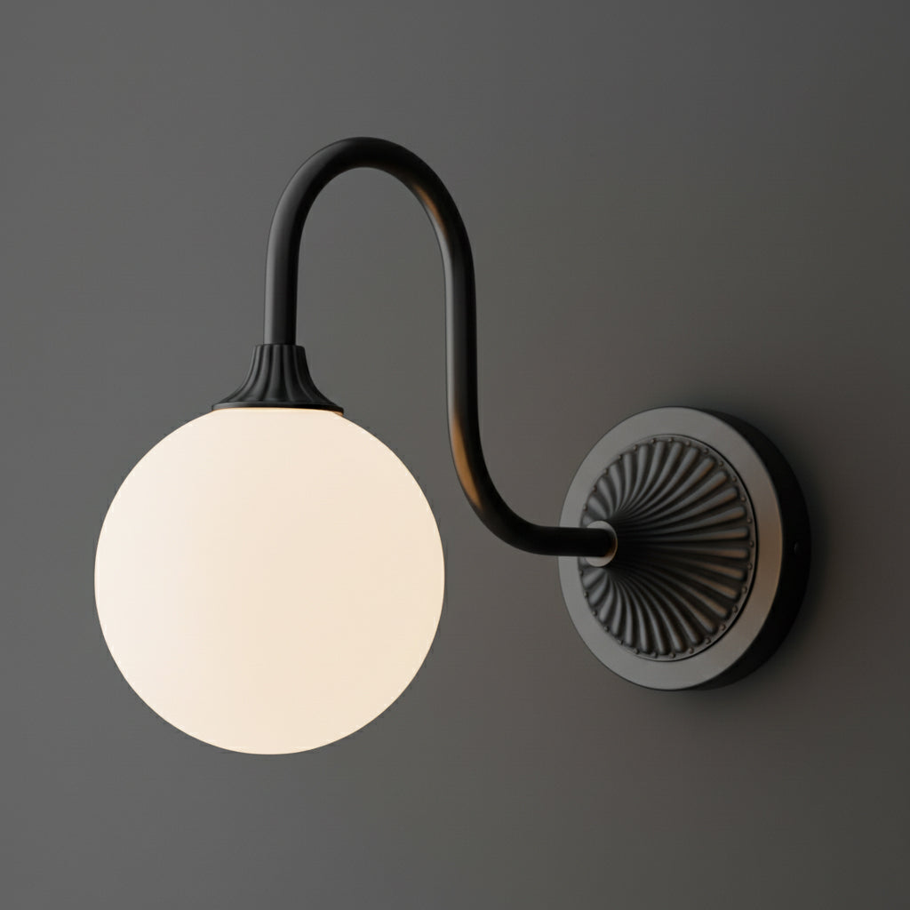 Black metal wall sconce with curved arm and frosted white glass globe shade. - SCONCE MODEL NO. 1085