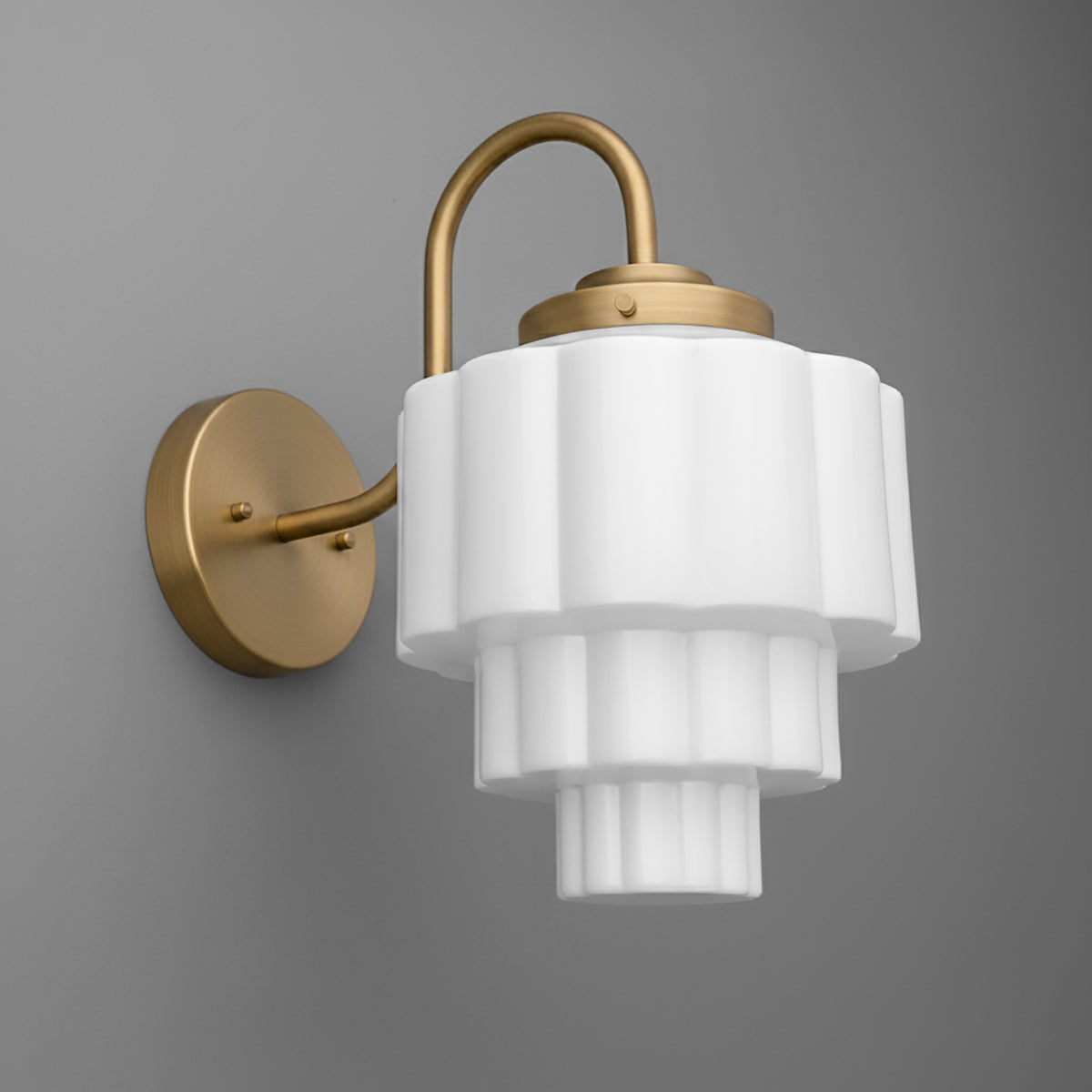 Wall-mounted sconce with tiered white frosted glass shade and brushed gold metal arm and base. - SCONCE MODEL NO. 1095