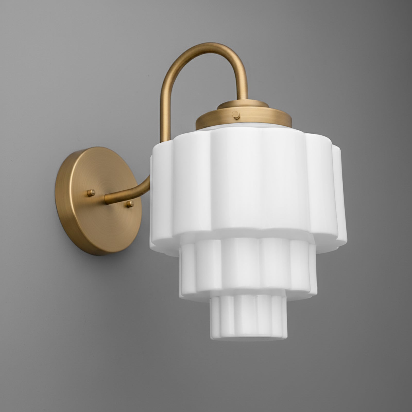 Wall-mounted sconce with tiered white frosted glass shade and brushed gold metal arm and base. - SCONCE MODEL NO. 1095