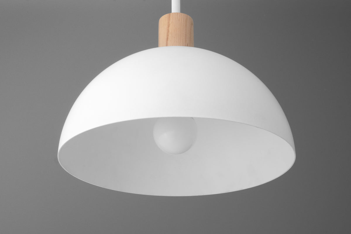 White dome-shaped pendant light with wooden accent and visible light bulb. - PENDANT MODEL NO. 4610