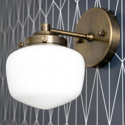 Art Deco wall sconce with round white glass globe and brushed antique brass fixture. - SCONCE MODEL NO. 7322