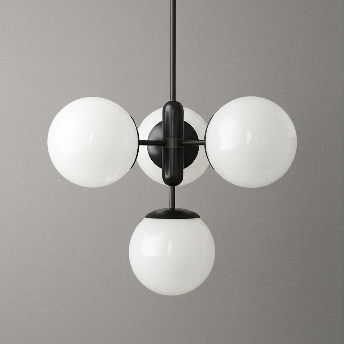 Art Deco chandelier with three white glass globes on black metal frame suspended from ceiling. - CHANDELIER MODEL NO. 4321