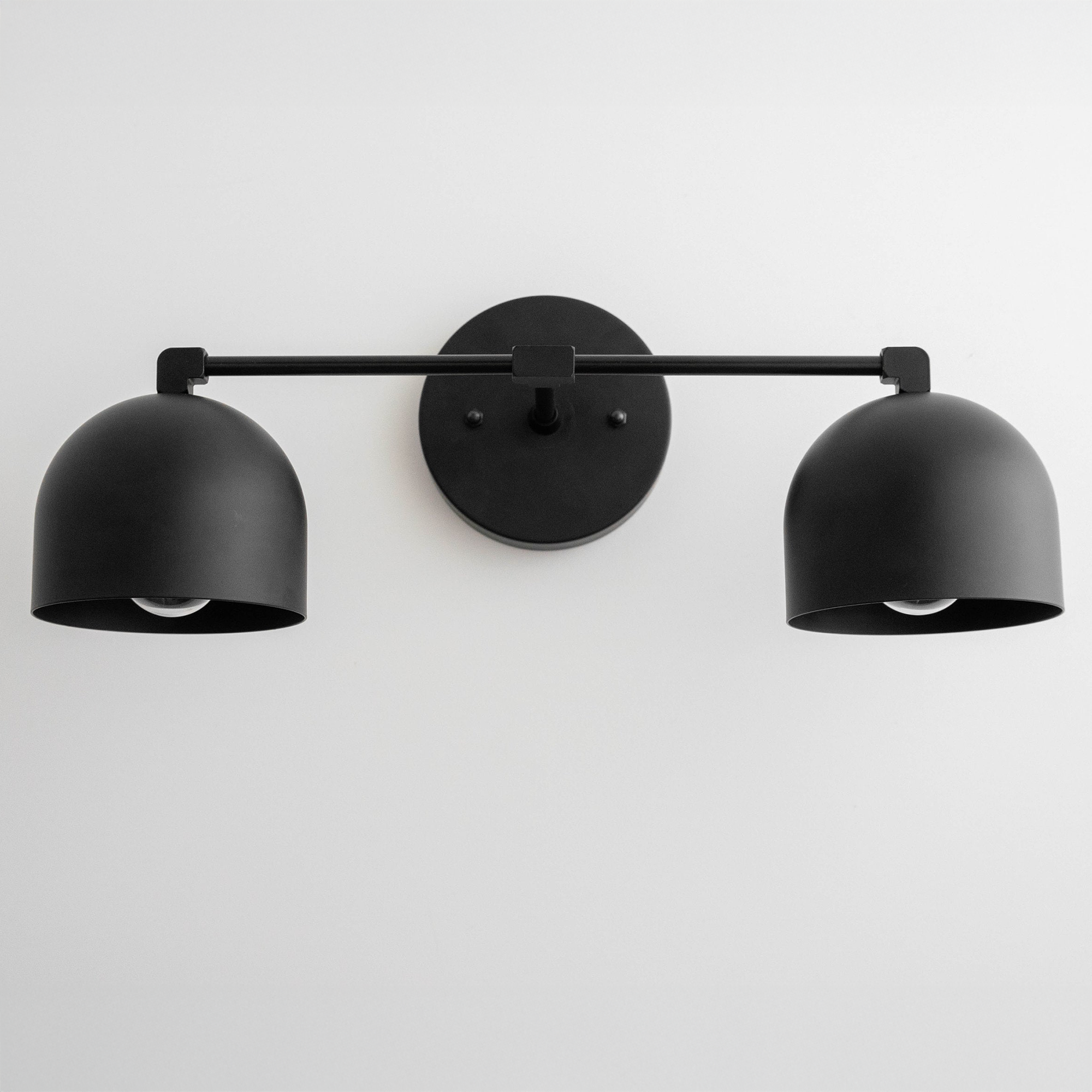 Mid-century modern black metal vanity light with two dome-shaped shades and round wall mount. - VANITY LIGHT MODEL NO. 0698