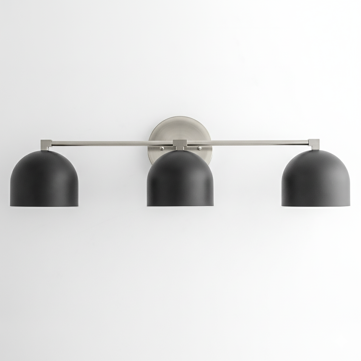 Mid-century modern 3-bulb vanity light with brushed nickel bar and matte black dome shades. - VANITY LIGHT MODEL NO. 7565