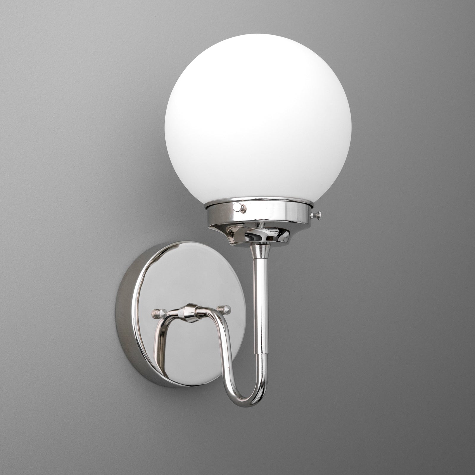 Wall sconce with polished chrome curved arm and frosted white globe shade. - SCONCE MODEL NO. 3690