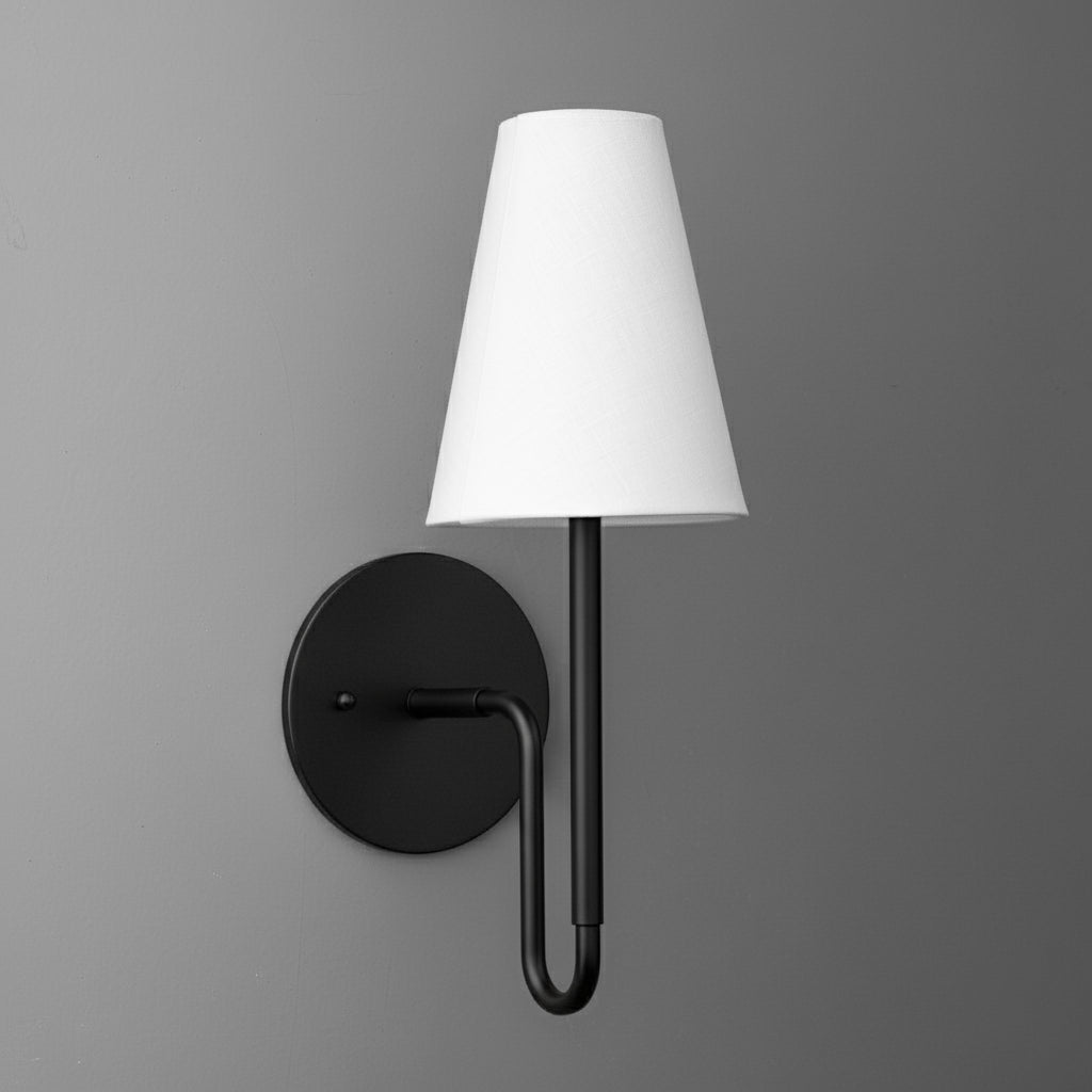 Black metal wall sconce with round base and white tapered fabric lampshade. - SCONCE MODEL NO. 1007