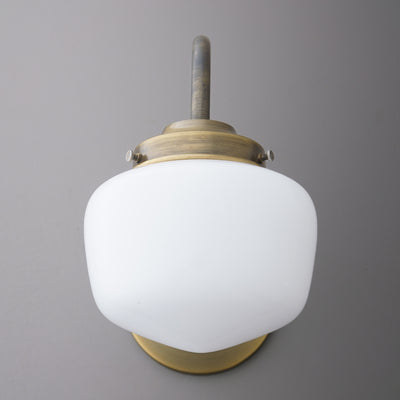 Wall sconce with frosted white glass shade and brushed brass metal fixture. - SCONCE MODEL NO. 1012