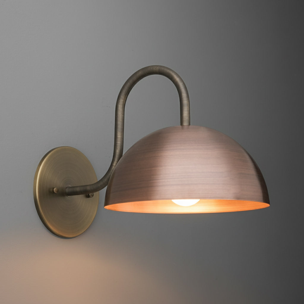 Wall-mounted bronze sconce with a curved arm and dome-shaped shade illuminating downward. - SCONCE MODEL NO. 4008