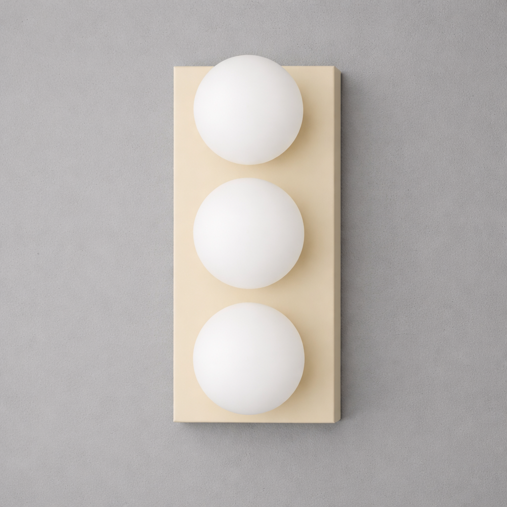 Three-bulb wall sconce with matte gold rectangular backplate and frosted white glass globes aligned vertically. - SCONCE MODEL NO. 2623