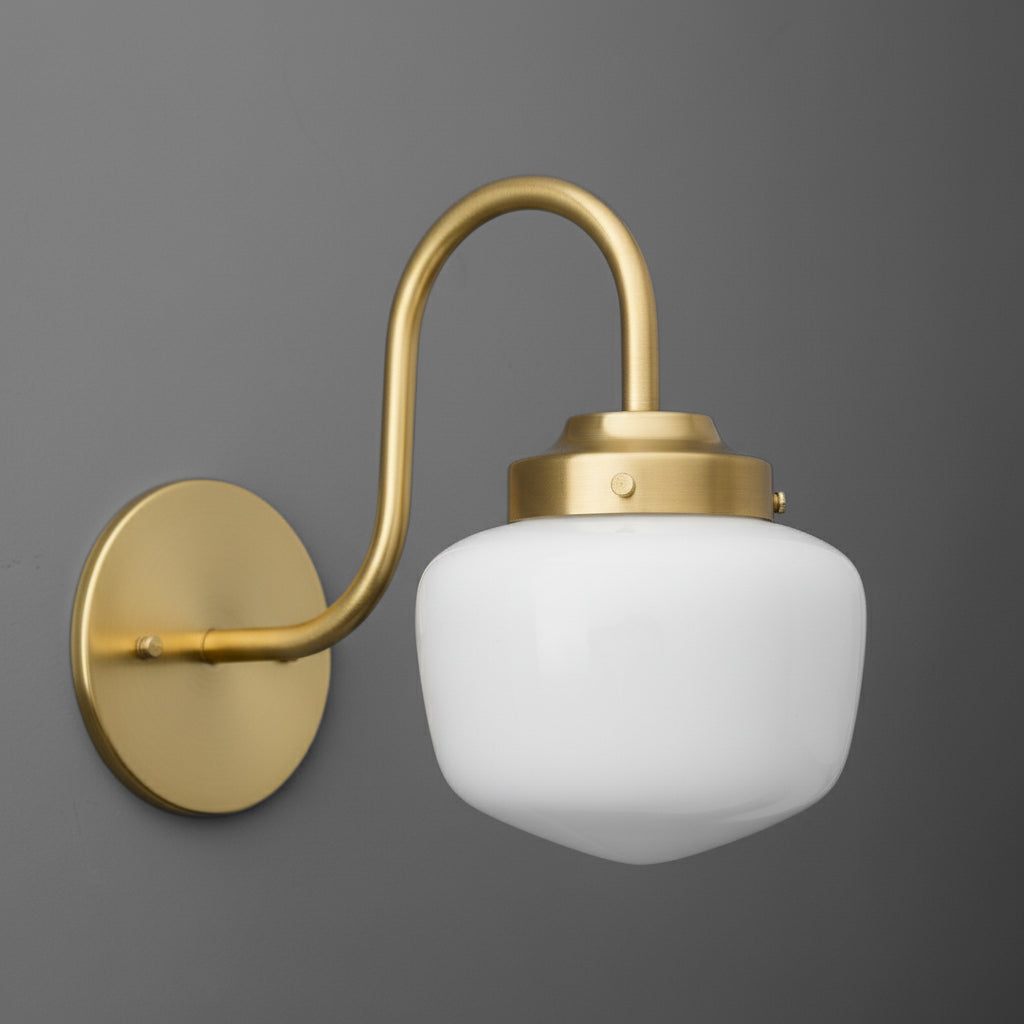 Wall sconce with curved brass arm and frosted white glass globe shade. - SCONCE MODEL NO. 1012