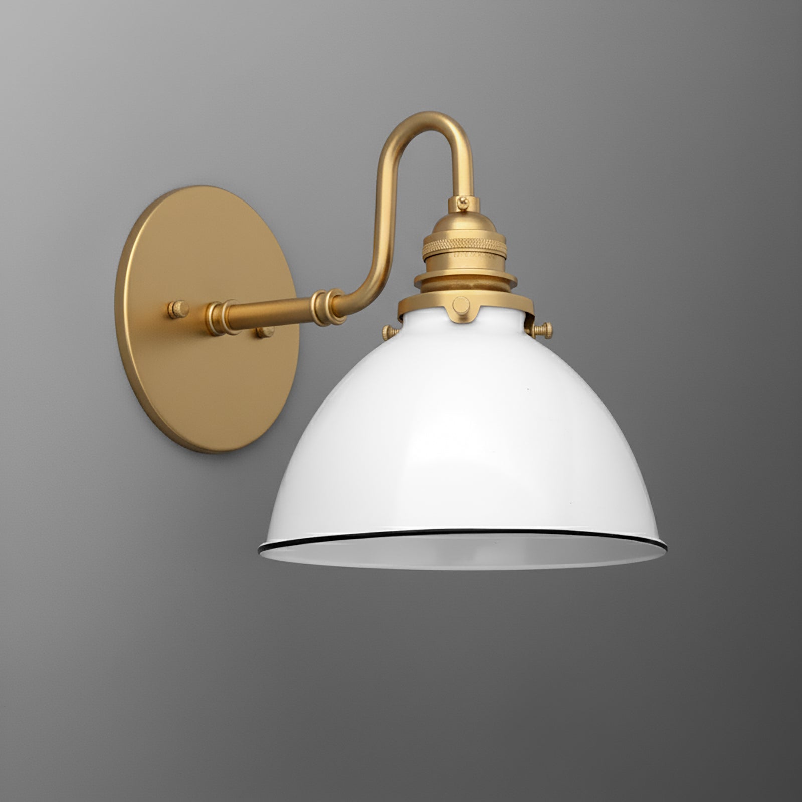 Wall-mounted sconce with a curved brass arm and matte white dome-shaped metal shade. - SCONCE MODEL NO. 2587