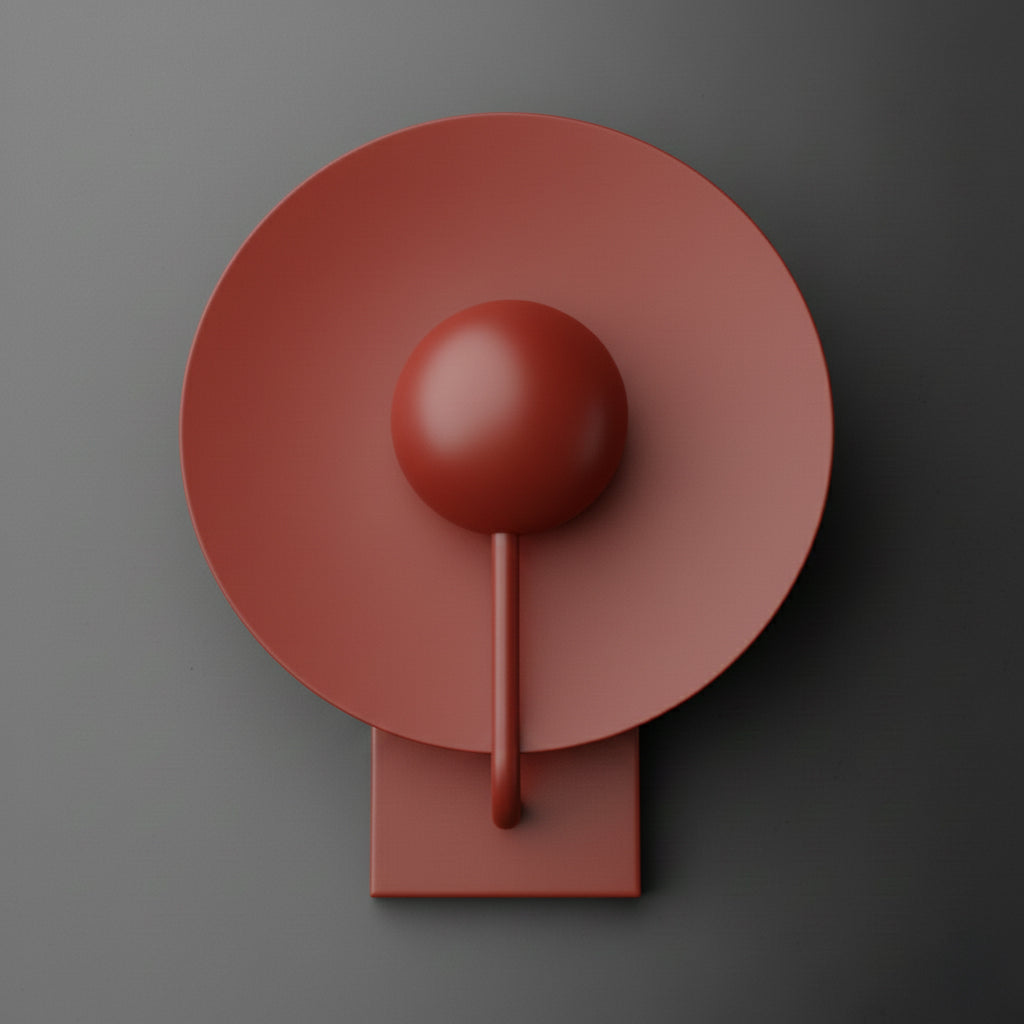 Single-light sconce in Brick Red with a large round disc shade behind a globe, held on a slim curved stem from a rectangular wall plate. - SCONCE MODEL NO. 9342