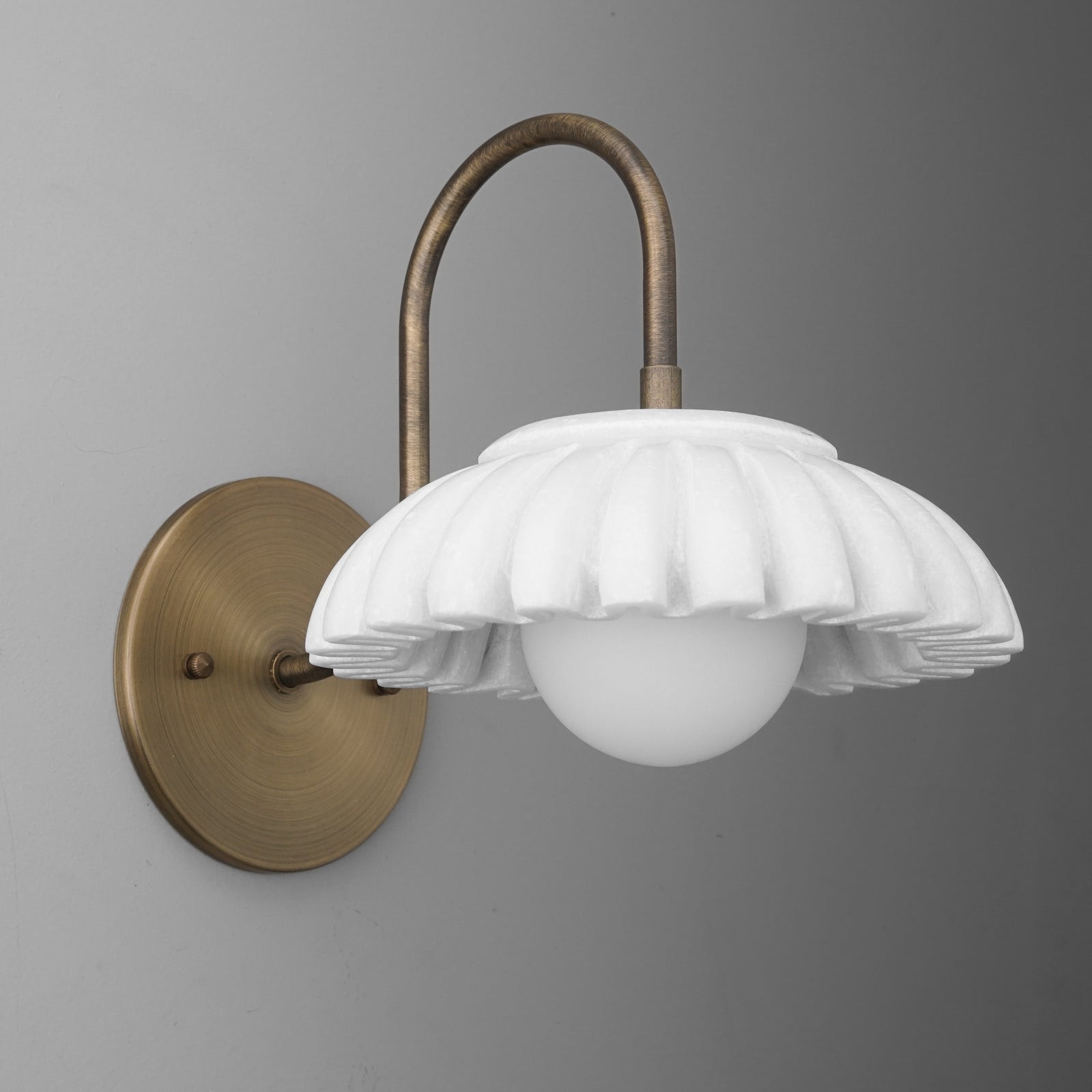 White fluted globe glass shade with antique brass curved arm wall sconce. - SCONCE MODEL NO. 2782