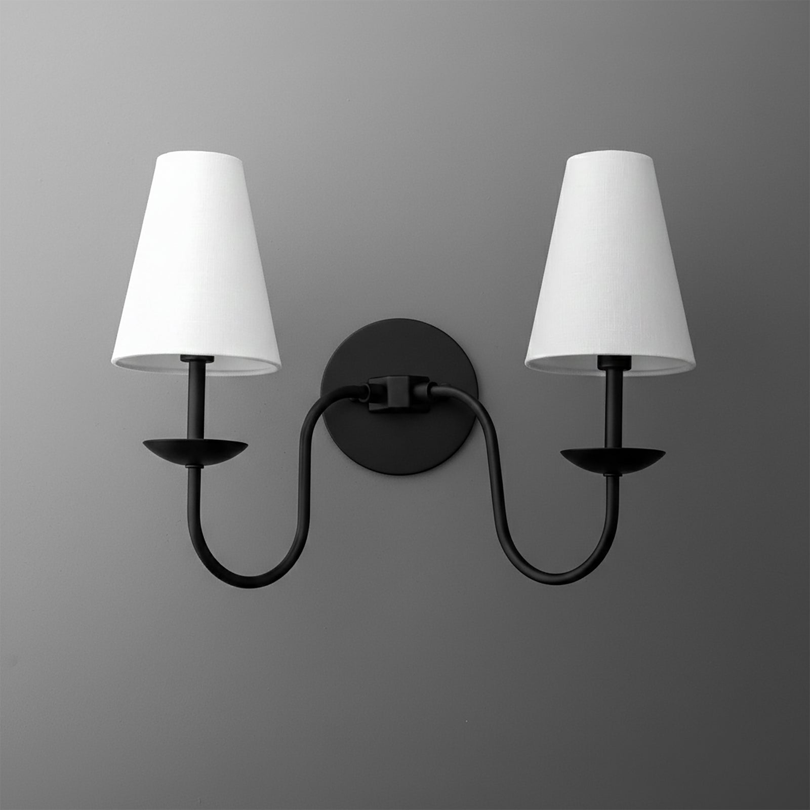 Black metal double-arm wall sconce with white tapered fabric shades and round mounting plate. - SCONCE MODEL NO. 5846