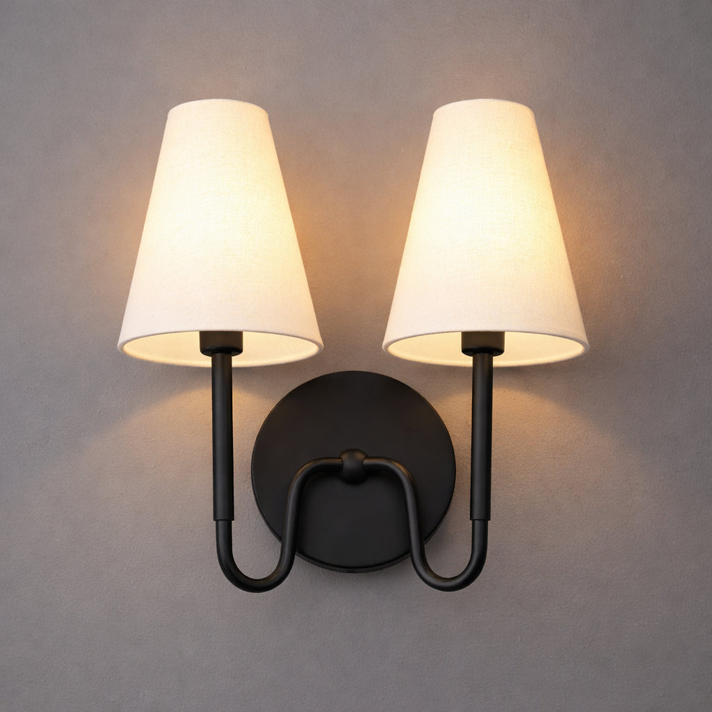 Two-light black metal wall sconce with cream fabric tapered shades and curved arms. - SCONCE MODEL NO. 5265