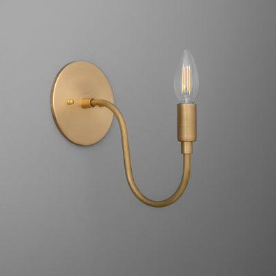 Matte gold metal wall sconce with curved arm and exposed vintage-style bulb. - SCONCE MODEL NO. 7321
