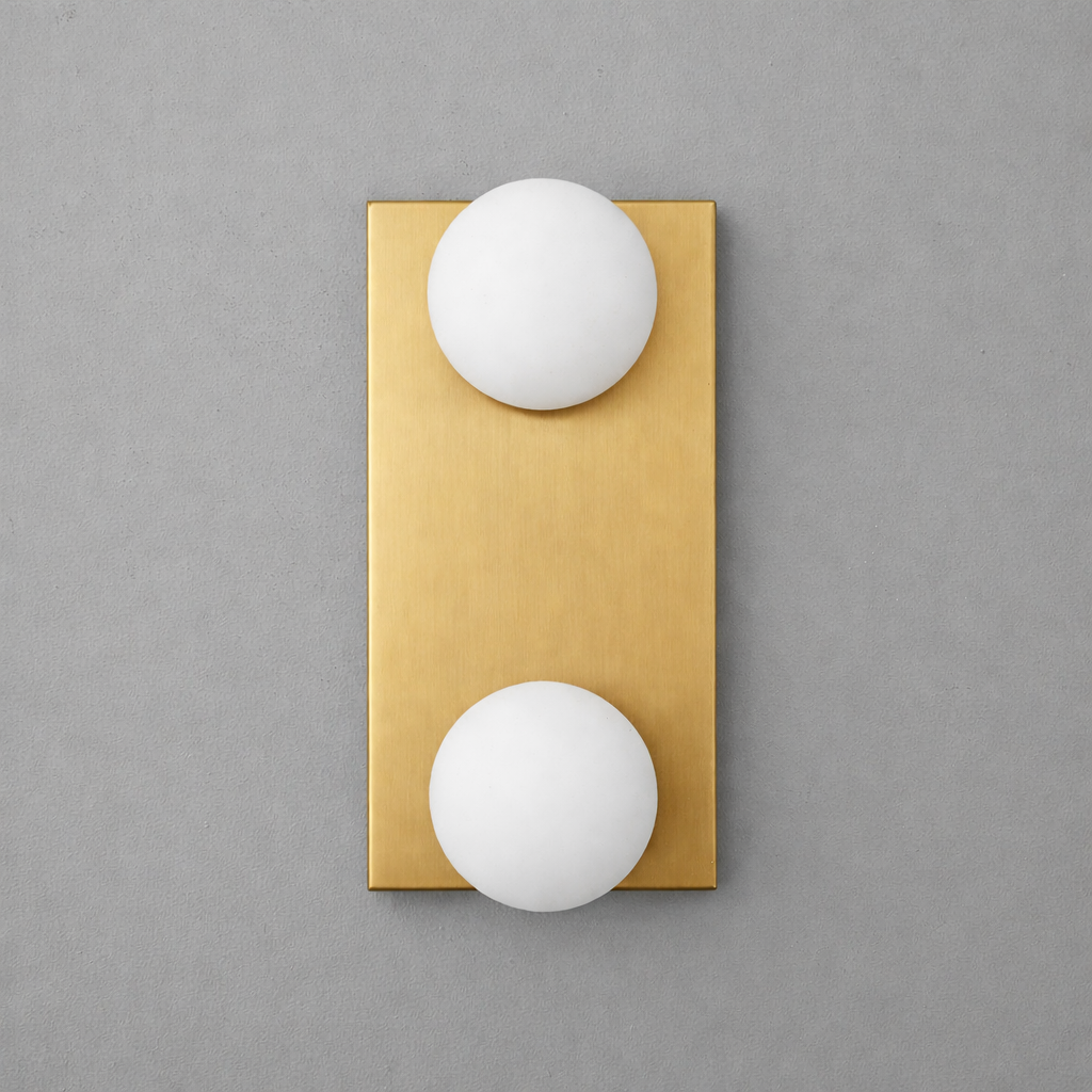 Brushed brass rectangular wall sconce with two round white glass bulbs vertically aligned. - SCONCE MODEL NO. 4016