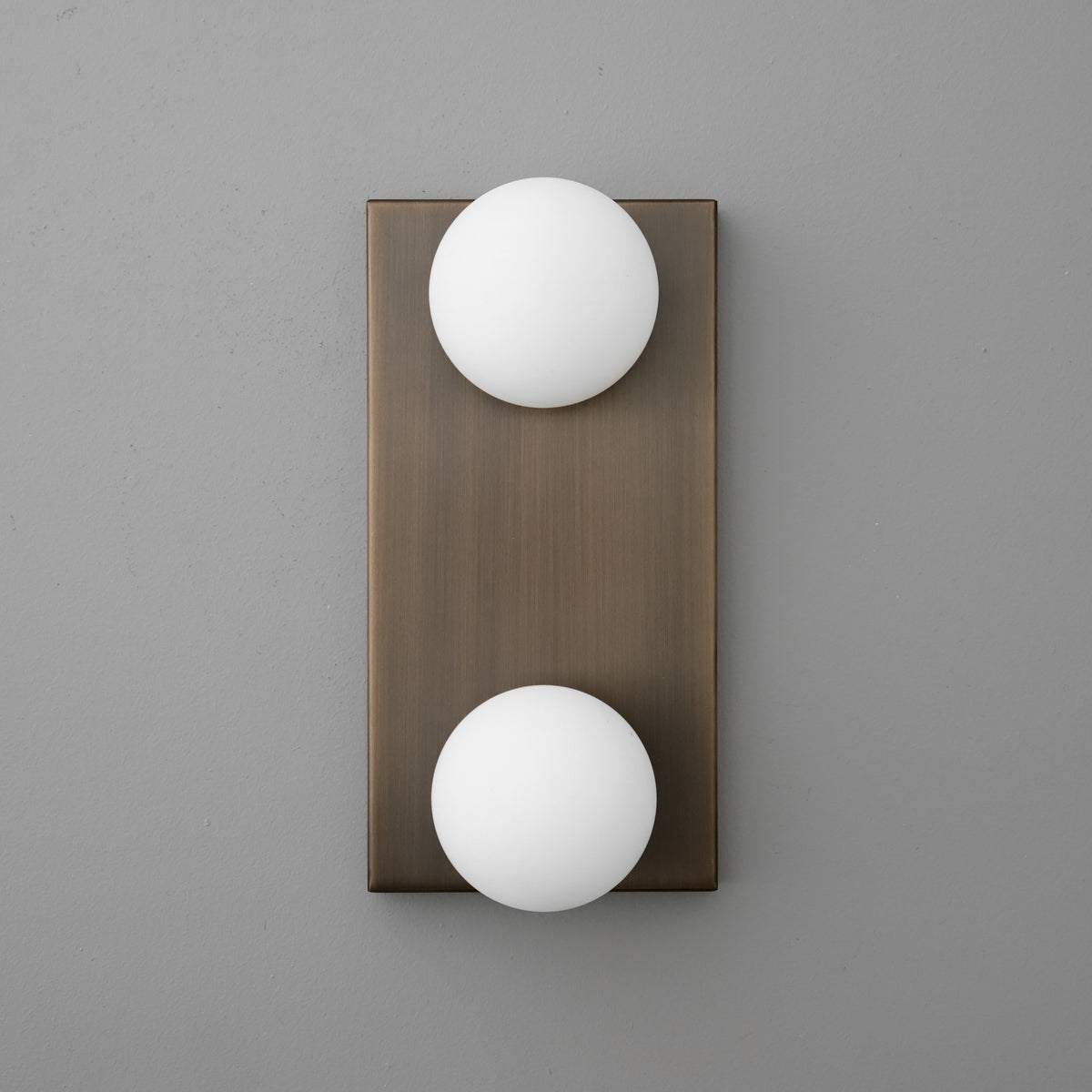 Bronze rectangular wall sconce with two white frosted glass globe shades, modern design. - SCONCE MODEL NO. 4016