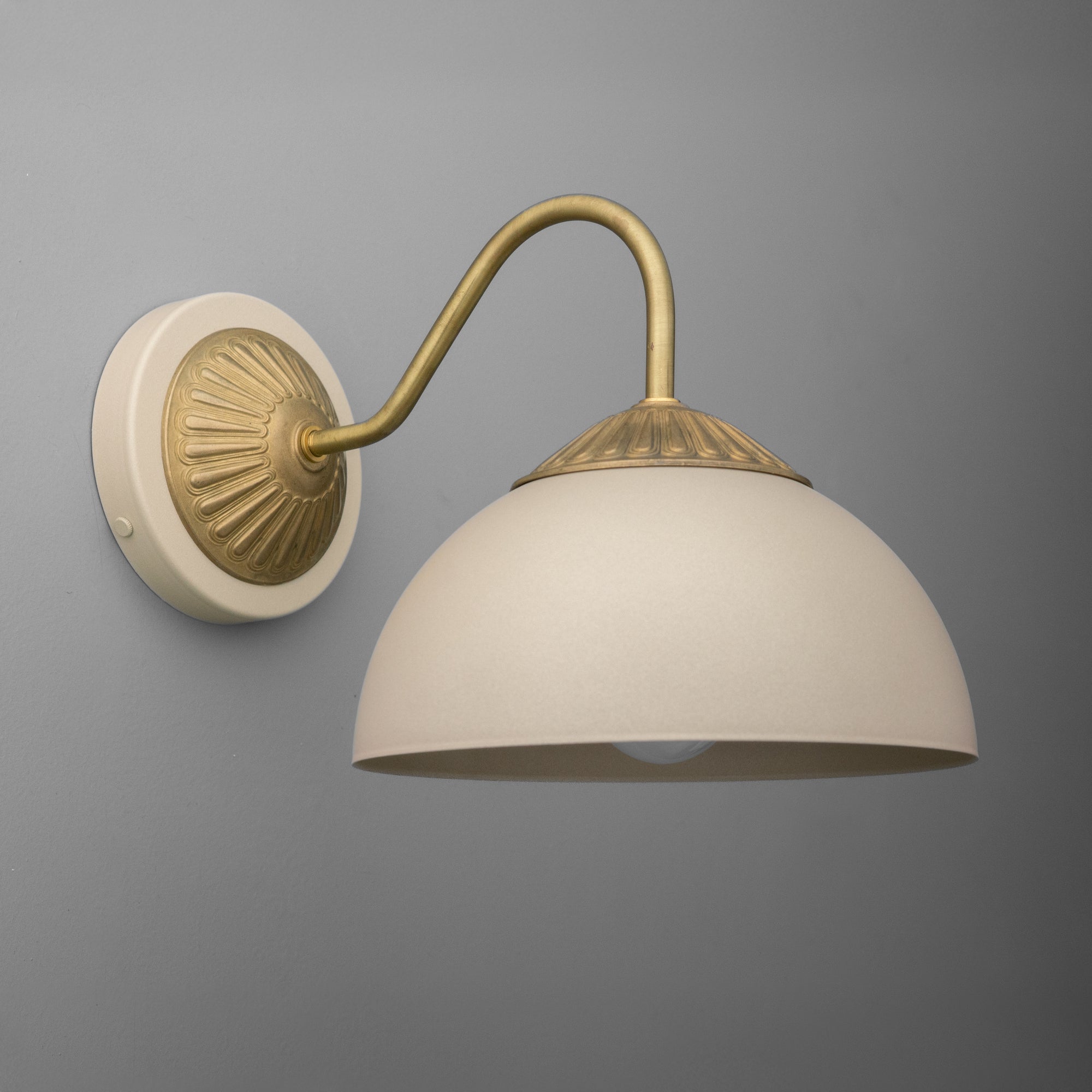 Raw brass wall sconce with cream dome shade and textured wall mount on gray background. - SCONCE MODEL NO. 9408