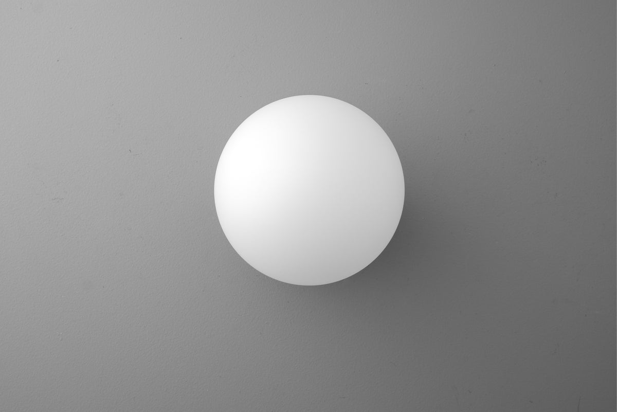 White spherical globe wall sconce with smooth matte finish against gray background. - SCONCE MODEL NO. 4943