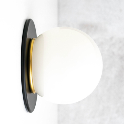 Mid-century modern wall sconce with matte black round base and frosted white glass globe light shade. - SCONCE MODEL NO. 9364