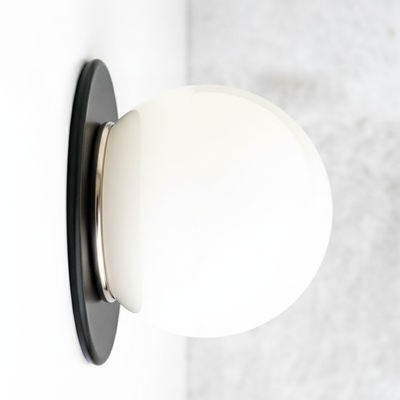 Mid-century modern black flush wall sconce with white glass globe and brass accents. - SCONCE MODEL NO. 9364