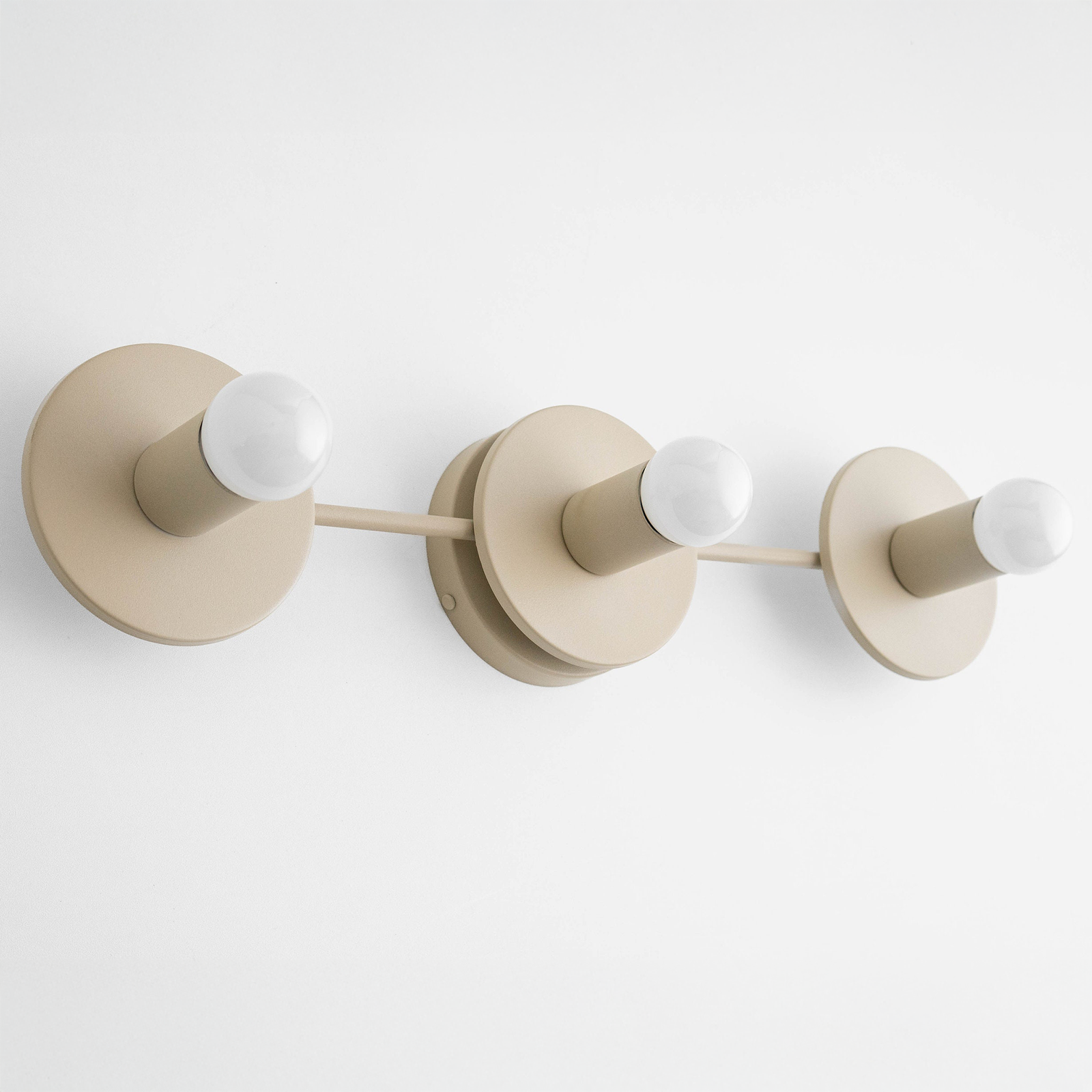 Mid-century modern cream vanity light fixture with three bare bulbs and circular wall mounts. - VANITY LIGHT MODEL NO. 5708