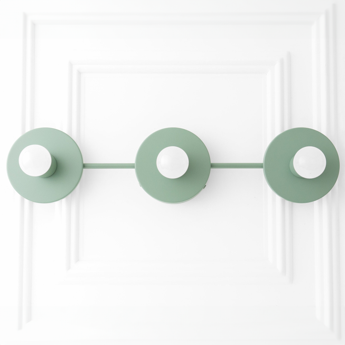 Mid-century modern vanity light with three round mint green metal bases and exposed bulbs on a horizontal bar. - VANITY LIGHT MODEL NO. 5708